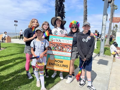 Marisol Marquez, Summer Sanders, and two young community members stand with students from IVA High’s GSA Club before marching on Ocean Blvd. in the Long Beach Pride Parade. 